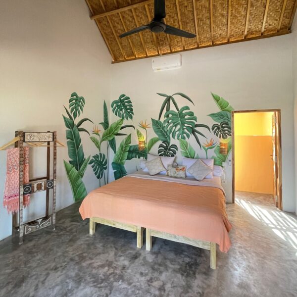 Fabulous Place Lombok Surf Villa orange bedroom with wall painting of flowers